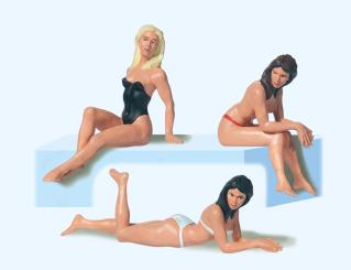 Sitzende und liegende Badende 