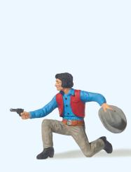 Cowboy kniend, mit Revolver 